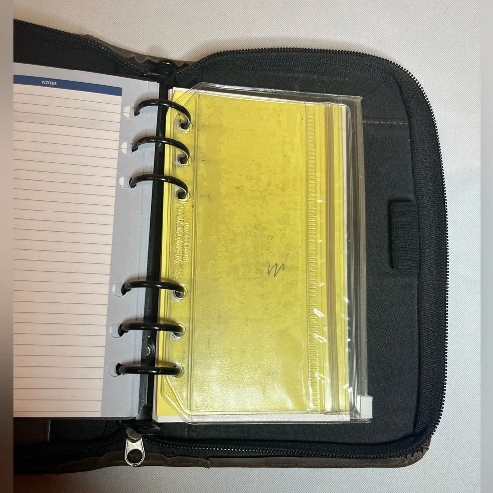 Day Timer Brown Folder With Some Papers